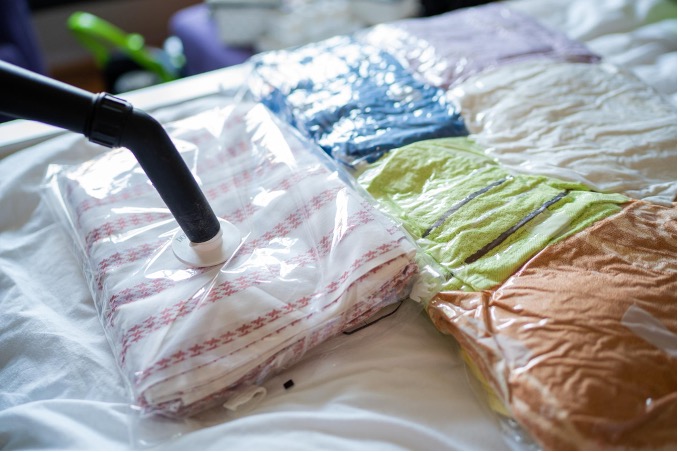 Vacuum packing clothes in plastic